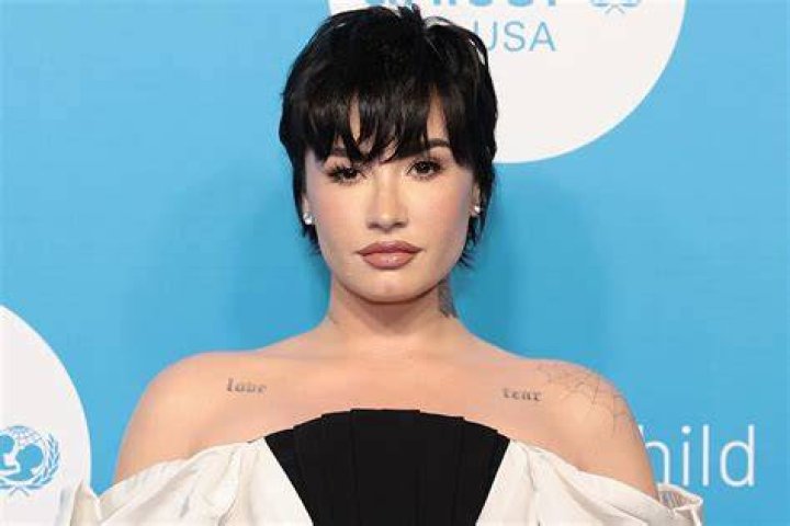 
Demi Lovato Shines in Elegant Off-the-Shoulder Gown That Showcases Her ‘Love’ and ‘Fear’ Tattoos 